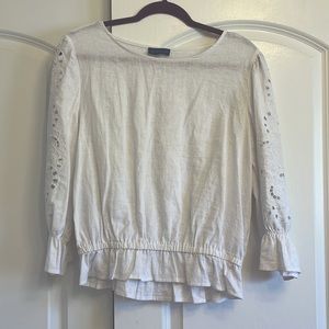 White linen blouse with eyelet details on the sleeves. Size M